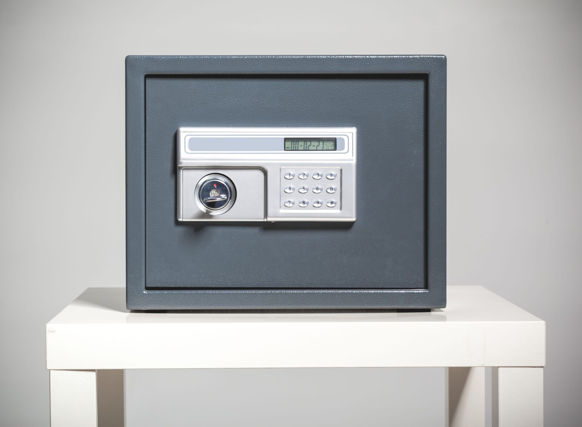 Closed safe on grey background